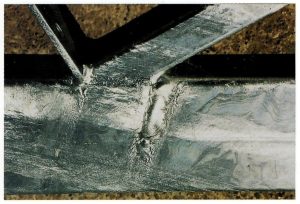 Description: Localised thick areas of zinc on surface.Cause: Zinc freezes on surface during draining. More likely to occur on thinner sections with large surface area that cool quickly. Remedy: Adjust dipping angles if possible, to alter drainage pattern to more acceptable mode. Dress thick sections of coating by buffing if they interfere with the items’ application. Durability improved because of the presence of additional zinc