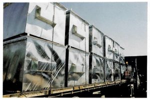 Description: Buckling of thin, flat plate used for sides of waste bins.Cause: Differential expansion and contraction of thin, flat plate during heating and cooling in the galvanizing process. Remedy: Use thicker plate. Use ribs or corrugations to stiffen flat sections. Accept a degree of distortion (as in this case) as appropriate for application and for significant durability benefits in high abrasion environments.