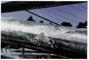 Description: Small areas of damaged or missing coating.Cause: Areas where item is resting on jigging or dipping equipment may suffer coating loss or damage because galvanized coating will bond item to support. Remedy: Minimise contact between item and support. Damaged areas can be touched-up with appropriate zinc rich paint according to International Standard.