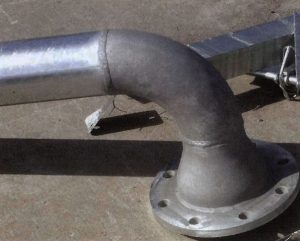 Description: Mottled grey/shiny coatings on large bore steel pipe.Cause: Reactive (high silicon) steel in borderline zone of reactivity. Grey areas are 100% alloy layer. Shiny areas have free zinc on surface. Slower cooling will produce a higher percentage of grey coatings on this type of steel. Remedy: Change steel grade. Cool as quickly as possible after removal from the galvanizing bath. Grey coatings are thicker and will always exceed minimum standard thickness and provide better durability as a result.