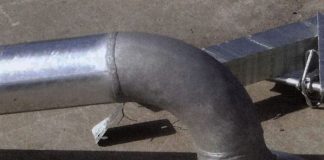 Description: Mottled grey/shiny coatings on large bore steel pipe. Cause: Reactive (high silicon) steel in borderline zone of reactivity. Grey areas are 100% alloy layer. Shiny areas have free zinc on surface. Slower cooling will produce a higher percentage of grey coatings on this type of steel. Remedy: Change steel grade. Cool as quickly as possible after removal from the galvanizing bath. Grey coatings are thicker and will always exceed minimum standard thickness and provide better durability as a result.