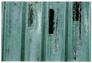 Description: Uncoated areas on universal section.Cause: These defects have been caused by factory applied stickers being left on the work. The adhesive cannot be removed in the pretreatment process and the steel surface does not pickle. Remedy: Remove stickers prior to delivery/processing. Mechanically removes adhesive residues or treat with concentrated paint stripper.