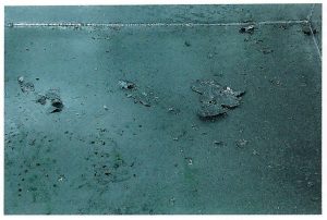 Description: Splashes and flakes of zinc loosely adherent to the galvanized surface.Cause: Moisture on surface causing molten zinc to ‘pop’ and splash droplets onto the item. Remedy: Wire brush or sweep flakes from surface and minimise splattering by drying work as much as possible and avoiding pockets that prevent complete drainage of liquors from the surface